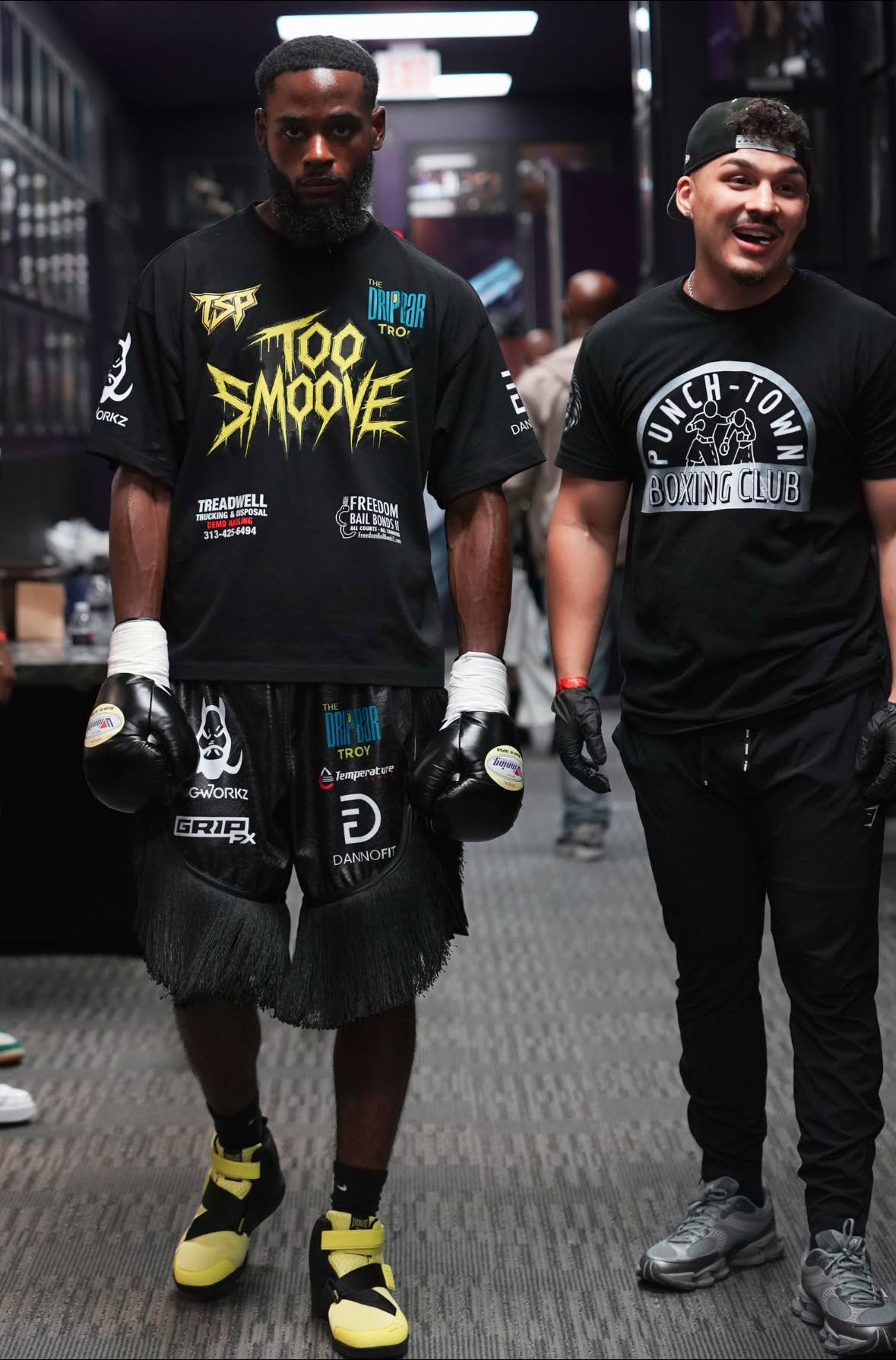 PunchTown coach and fighter together at a boxing event