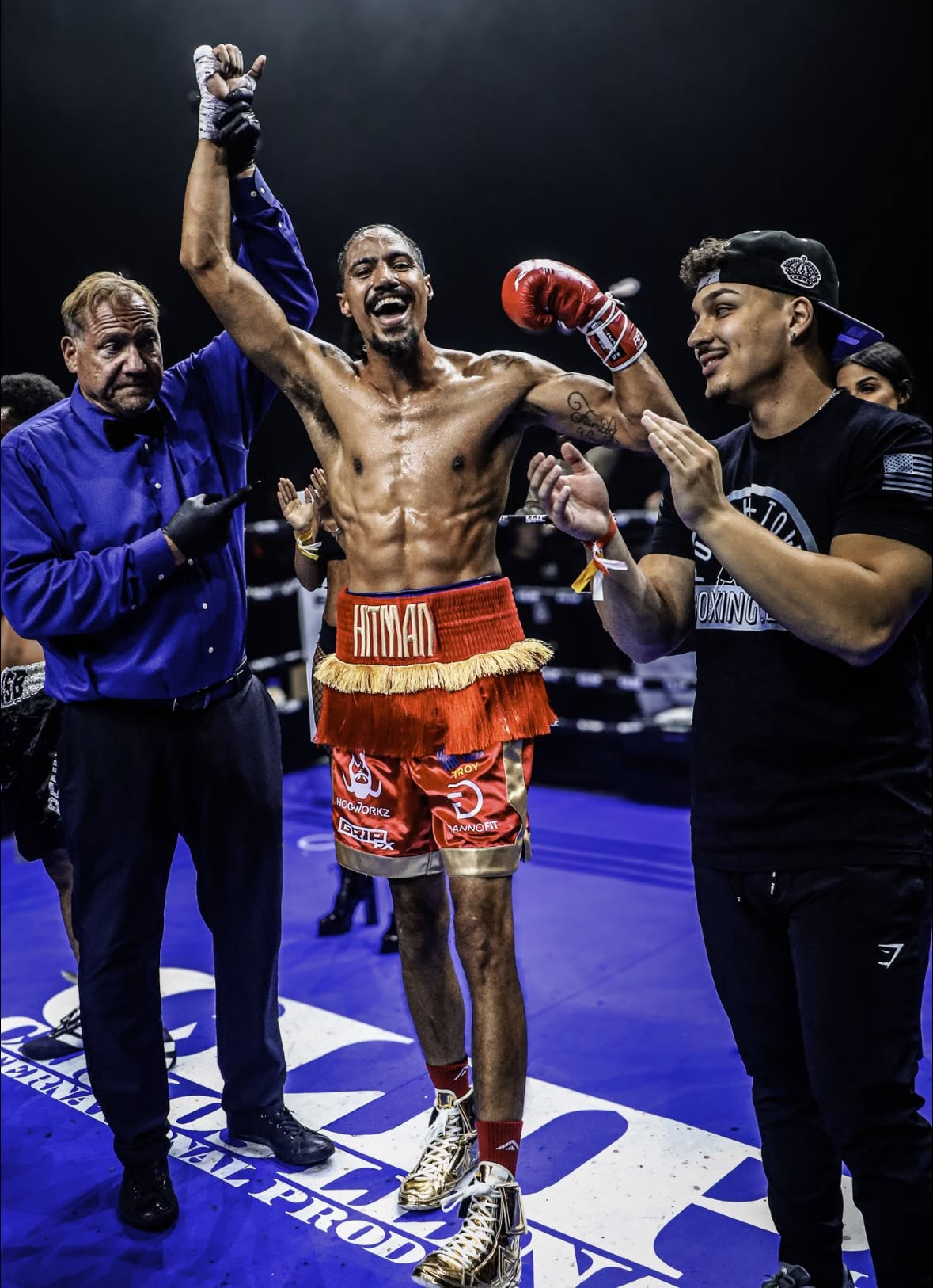 A PunchTown boxer celebrating a victory in the ring